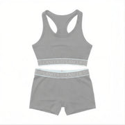 Flat lay of AstroWorld Cancer Sport Bra Set in Grey